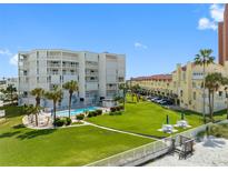 Aerial view of condo building with pool and oceanfront location at 17980 Gulf Blvd # 501, Redington Shores, FL 33708