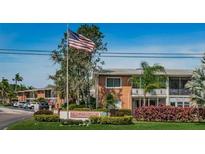 Lake Overlook Condominium complex with lush landscaping and parking at 4550 Overlook Ne Dr # 257, St Petersburg, FL 33703