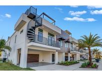 Modern townhouses with spiral staircases and private garages at 460 87Th Avenue North, St Petersburg, FL 33702