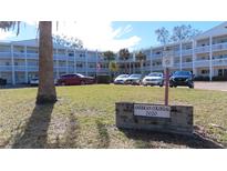 American Colonial 2020 building, featuring ample parking and landscaping at 2020 N World Parkway Blvd # 12, Clearwater, FL 33755