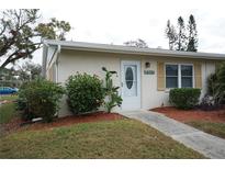 Inviting exterior of a single-story home with well-manicured landscaping at 2202 Clubhouse Dr # 173, Sun City Center, FL 33573