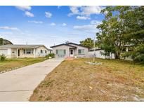 Updated bungalow with driveway, landscaping, and fenced yard at 4535 33Rd N Ave, St Petersburg, FL 33713