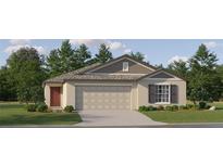 One-story home with neutral siding, two-car garage, and landscaping at 12968 Shining Blue Nile Ln, Parrish, FL 34219