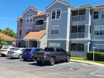 Building exterior featuring a contemporary design and ample parking at 18001 Richmond Place Dr # 721, Tampa, FL 33647