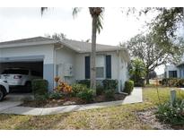 Well-maintained villa with attached garage and landscaped grounds at 2182 Acadia Greens Dr # 66, Sun City Center, FL 33573