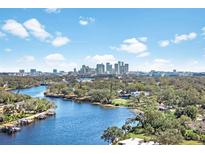 Aerial view of waterfront homes with city skyline in background at 2424 W Tampa Bay Blvd # C212, Tampa, FL 33607