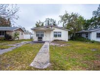 House exterior featuring a walkway and lawn at 3712 56Th N Ave, St Petersburg, FL 33714