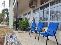 Relaxing patio with blue chairs, perfect for enjoying the Florida sunshine at 5745 40Th N Ave # 152B, St Petersburg, FL 33709