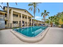 Refreshing community pool with surrounding patio at 2 N Fernwood Ave # 16, Clearwater, FL 33765