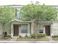 Inviting two-story townhome with landscaping and a charming facade at 20414 Berrywood Ln, Tampa, FL 33647