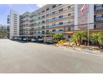 Condo building with parking and tropical landscaping at 8186 Terrace Garden N Dr # 604, St Petersburg, FL 33709