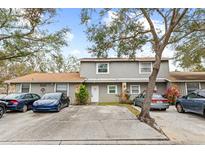 Two-story townhome with parking and landscaping at 10061 Lake Oak Cir, Tampa, FL 33624