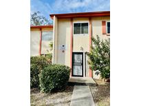 Inviting exterior of a two-story building with a well-maintained walkway at 5801 16Th S St # 2, St Petersburg, FL 33705