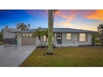 Updated single story home with attached garage and RV parking at 141 Singapore Rd, Punta Gorda, FL 33950