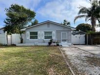 Charming single story home with a landscaped lawn and white picket fence at 3131 17Th N St, St Petersburg, FL 33713