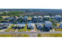 Aerial view of canal-front property with a large lot and nearby waterfront homes at 4024 Centavo Ct, Hernando Beach, FL 34607