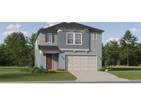 Two-story home with attached garage and landscaping at 11555 E 71St Ter, Palmetto, FL 34221