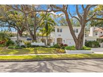 Beautiful two-story home with lush landscaping and a large driveway at 4306 W Swann Ave, Tampa, FL 33609