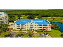 Aerial view of condo community near water, golf course at 2323 Feather Sound Dr # 106, Clearwater, FL 33762