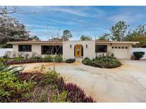 Ranch style home with mature landscaping and a circular driveway at 6226 Hampton N Ct, St Petersburg, FL 33710
