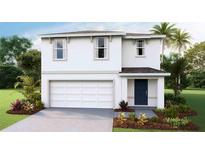 Two-story house featuring a white exterior, two-car garage, and landscaping at 5247 Salt Marsh Rd, Wimauma, FL 33598