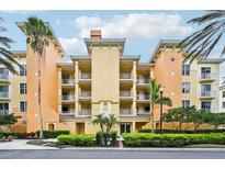 Attractive three-story condo building with lush landscaping at 6330 Watercrest Way # 404, Bradenton, FL 34202
