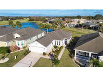 Aerial view of a single-Gathering home in a golf course community at 1112 Jasmine Creek Ct, Sun City Center, FL 33573