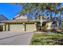 Beautiful 3-car garage home with landscaped yard at 5107 Lady Rose Ct, Lutz, FL 33558