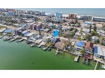 Waterfront home with private docks, beach access, and potential for new construction on adjacent lot at 14157 N Bayshore Dr, Madeira Beach, FL 33708