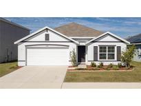 White and gray two-story house with a two-car garage and landscaped lawn at 5462 Logan Cave Ave, Wimauma, FL 33598