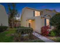 Inviting two-story townhome with landscaping and a walkway at 6333 Osprey Lake Cir, Riverview, FL 33578