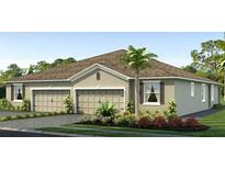 Two-story home with a three-car garage and landscaping at 4059 Westwood Fields Loop, Plant City, FL 33565