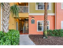 Exterior of condo building with stairs and landscaping at 4207 S Dale Mabry Hwy # 5205, Tampa, FL 33611