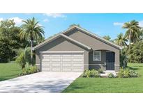 Single-story house with a two-car garage and landscaping at 4471 Sand Dollar Way, Zephyrhills, FL 33541