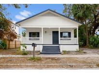 Charming renovated bungalow with a front porch and gray accents at 1740 W Cherry St, Tampa, FL 33607