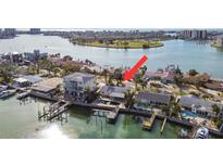 Aerial view of waterfront home with private pool and boat dock at 8114 Causeway S Blvd, St Petersburg, FL 33707