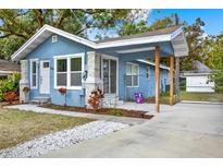Charming light blue house with covered porch at 1214 E Curtis St, Tampa, FL 33603