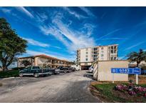 Condo building with parking and waterfront landscaping at 6145 Sun Blvd # 103, St Petersburg, FL 33715