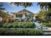 Charming bungalow with a landscaped front yard and inviting porch at 136 16Th Ne Ave, St Petersburg, FL 33704