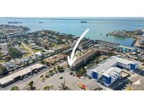 Aerial view showing condo building near waterfront at 460 Paula S Dr # 401, Dunedin, FL 34698