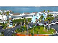Waterfront condo complex features lush landscaping, covered parking, and stunning views of the bay at 5155 S Isla Key S Blvd # 202, St Petersburg, FL 33715