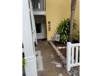 Inviting condo entryway with landscaping and walkway at 3540 42Nd S St # C, St Petersburg, FL 33711