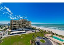 Aerial view of beachfront condo building with ocean and pool views at 1460 Gulf Blvd # 811, Clearwater Beach, FL 33767
