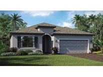 One-story home with gray siding, brown roof, and a two-car garage at 16000 Honeysuckle St, Port Charlotte, FL 33953
