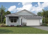 One-story home with gray siding, white garage door, and landscaping at 11683 Rose Gold Ct, Venice, FL 34293