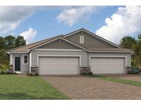 Two-story home with three-car garage and attractive landscaping at 18491 Green Garden Ct, Venice, FL 34293