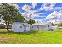 Two small houses with a grassy backyard at 1509 Sw 7Th St, Ruskin, FL 33573