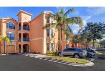 Building exterior showcasing attractive architectural details and landscaping at 2738 Via Tivoli # 220B, Clearwater, FL 33764