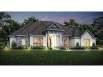 Stunning one-story home with stone accents and a landscaped lawn at 13510 Haflinger Way, Hudson, FL 34667