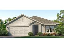 One-story home with a light beige exterior, gray roof, and landscaped front yard at 6123 Distant Haze Pl, Palmetto, FL 34221
